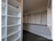 Spacious walk-in closet with built-in shelving and carpet flooring, offering ample storage at 251 Luray Way # 441, Rock Hill, SC 29730