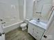 Bright bathroom with a shower and tub, white cabinets, and tile-look flooring at 2705 Eagle Dr, Lincolnton, NC 28092