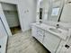 Elegant bathroom with double vanity, quartz countertop, and a large mirror at 2705 Eagle Dr, Lincolnton, NC 28092