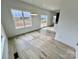 Bright dining area with wood floors, modern lighting, and large windows at 2705 Eagle Dr, Lincolnton, NC 28092