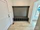 Entryway with wood-look floors, built-in bench and storage, and natural light at 2705 Eagle Dr, Lincolnton, NC 28092