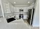 Modern kitchen features white cabinets, stainless steel appliances, and quartz countertops at 2705 Eagle Dr, Lincolnton, NC 28092
