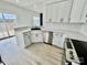 Well-lit kitchen with white cabinets, stainless steel appliances, and a corner sink at 2705 Eagle Dr, Lincolnton, NC 28092