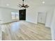 Bright living room with wood floors, a fireplace, and ceiling fan at 2705 Eagle Dr, Lincolnton, NC 28092
