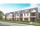 Charming multi-Gathering townhome with a brick facade, black window frames, and manicured landscaping at 3108 Endhaven Terraces Ln # 7, Charlotte, NC 28277