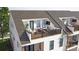 Relaxing rooftop deck with modern outdoor seating, TV, and stylish railings at 3108 Endhaven Terraces Ln # 7, Charlotte, NC 28277