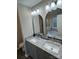 Bathroom featuring double sink vanity with granite countertop, modern lights and framed mirrors at 3121 Strong Box Ln, Gastonia, NC 28052