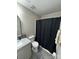Bathroom featuring granite countertop vanity, toilet, and tub with curtain at 3121 Strong Box Ln, Gastonia, NC 28052
