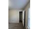 Bedroom featuring neutral walls, carpeted floor, a window, and closet with opened door at 3121 Strong Box Ln, Gastonia, NC 28052