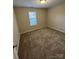 Bedroom featuring neutral walls, carpeted floor, and a window at 3121 Strong Box Ln, Gastonia, NC 28052