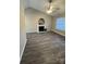 Open-concept living room boasts vaulted ceilings and a cozy fireplace at 3121 Strong Box Ln, Gastonia, NC 28052