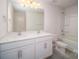 Bright bathroom featuring a double sink vanity with white cabinets and a shower-tub combination with tile surround at 5153 Fireweed Dr, Dallas, NC 28034