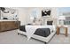 Stylish bedroom showcasing modern decor, a comfortable bed with plush pillows, and a wooden dresser at 5156 Fireweed Ct, Dallas, NC 28034