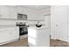 Well-lit kitchen featuring gray cabinets, stainless steel appliances, granite countertops, and a central island for meal preparation at 5156 Fireweed Ct, Dallas, NC 28034
