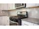 Stainless steel oven and granite countertops in bright kitchen with white subway tile backsplash at 5153 Fireweed Dr, Dallas, NC 28034