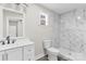 Bathroom with a white vanity, framed mirror, and tiled walk-in shower at 533 3Rd St, Chester, SC 29706