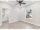 Bright bedroom with wood-look floors, ceiling fan, and ensuite bathroom at 533 3Rd St, Chester, SC 29706
