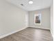Bedroom featuring a large window and light gray vinyl plank flooring at 533 3Rd St, Chester, SC 29706
