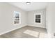 Well-lit bedroom with wood-look floors and large windows at 533 3Rd St, Chester, SC 29706
