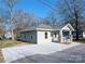 Charming single-story home featuring a covered porch with stone accents and a newly paved driveway at 533 3Rd St, Chester, SC 29706