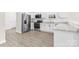 Modern kitchen boasts stainless steel appliances, white cabinets, and light gray vinyl plank flooring at 533 3Rd St, Chester, SC 29706