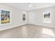 Inviting living room featuring three large windows and light gray vinyl plank flooring at 533 3Rd St, Chester, SC 29706