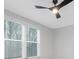 Bright bedroom featuring a modern ceiling fan and large windows with blinds for natural light at 600 Campus St, Charlotte, NC 28216
