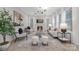 Bright living room with a fireplace, modern lighting, neutral furniture, and plenty of natural light at 600 Campus St, Charlotte, NC 28216
