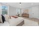 Main bedroom featuring a king bed, soft neutral colors, and a modern dresser with a soft chair at 600 Campus St, Charlotte, NC 28216