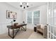 Cozy home office featuring wood floors, lots of natural light, and a modern ceiling light at 600 Campus St, Charlotte, NC 28216