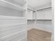 Bright walk-in closet featuring built-in shelving, drawers, and storage for all of your clothing at 600 Campus St, Charlotte, NC 28216
