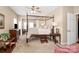 Traditional primary bedroom with canopy bed, ceiling fan, and sitting area at 6006 Union Pacific Ave # 2B, Charlotte, NC 28210