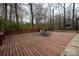 Large wooden deck with lounge chairs offers a perfect spot to relax amidst nature at 7210 Timber Ridge Dr, Mint Hill, NC 28227
