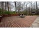 Spacious wooden deck with outdoor seating, ideal for entertaining and enjoying a serene backyard setting at 7210 Timber Ridge Dr, Mint Hill, NC 28227