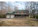 Charming two-story brick home with a covered front porch and a two-car garage, perfect for Gathering living at 7210 Timber Ridge Dr, Mint Hill, NC 28227