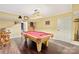 Entertaining game room features a pool table and dark hardwood floor at 7210 Timber Ridge Dr, Mint Hill, NC 28227