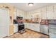 Functional kitchen with white cabinetry, stainless steel appliances, and updated backsplash at 7210 Timber Ridge Dr, Mint Hill, NC 28227