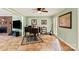 Bright living room with tile flooring, a brick fireplace, and natural light from large windows at 7210 Timber Ridge Dr, Mint Hill, NC 28227
