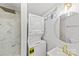 Modern bathroom with a stackable washer and dryer, and gold hardware fixtures at 723 Wood St, Statesville, NC 28677
