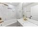 Bright bathroom with white marble tiles and gold hardware fixtures at 723 Wood St, Statesville, NC 28677