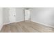 This bedroom features sleek, modern flooring and neutral paint, creating a serene and spacious atmosphere at 723 Wood St, Statesville, NC 28677