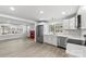 Modern kitchen with stainless steel appliances and a bright view into the living area with fireplace at 723 Wood St, Statesville, NC 28677
