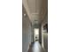 Hallway shot featuring hardwood floors and overhead attic access at 8508 Colgate Cir, Charlotte, NC 28214
