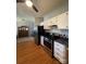 An open kitchen featuring stainless steel appliances and hardwood floors at 8508 Colgate Cir, Charlotte, NC 28214