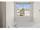 Bathtub with window, featuring natural light at 8583 Carolina Lily Ln, Charlotte, NC 28262