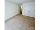 Neutral-colored bedroom with carpeting and double closets at 8583 Carolina Lily Ln, Charlotte, NC 28262