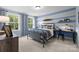 Stylized bedroom featuring a steel frame bed, two windows, striped curtains, and blue, gray, and white painted stripes at 889 Regulus Ct, York, SC 29745