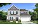 New construction two-story home showcasing gray siding, stone accents, covered porch, and an attached two-car garage at 889 Regulus Ct, York, SC 29745