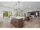 Spacious kitchen with an island and an open floor plan that merges into the dining and living room areas at 889 Regulus Ct, York, SC 29745
