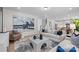 Open-concept living room featuring a comfortable sofa, modern decor, and seamless flow to the kitchen and dining area at 889 Regulus Ct, York, SC 29745
